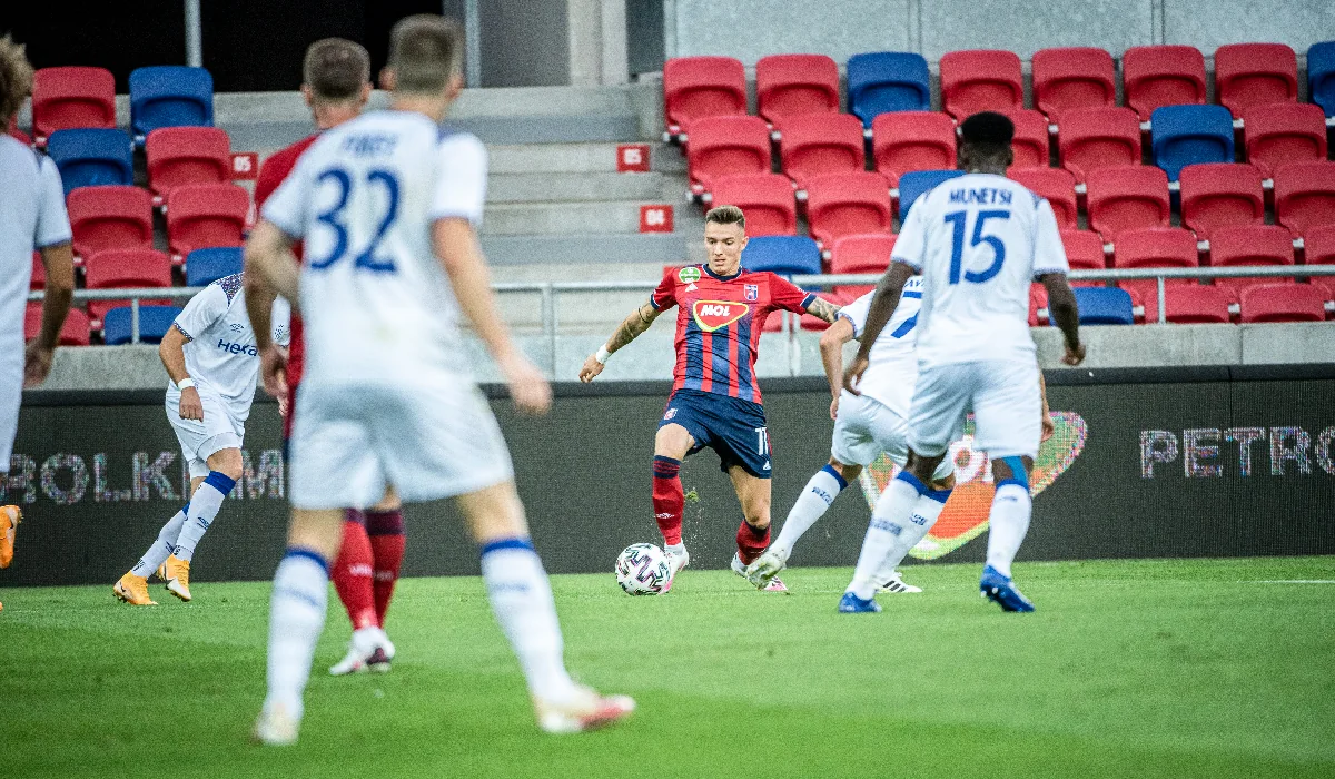 Reims players in white defending against Fehervar during Europa League qualifying in September 2020