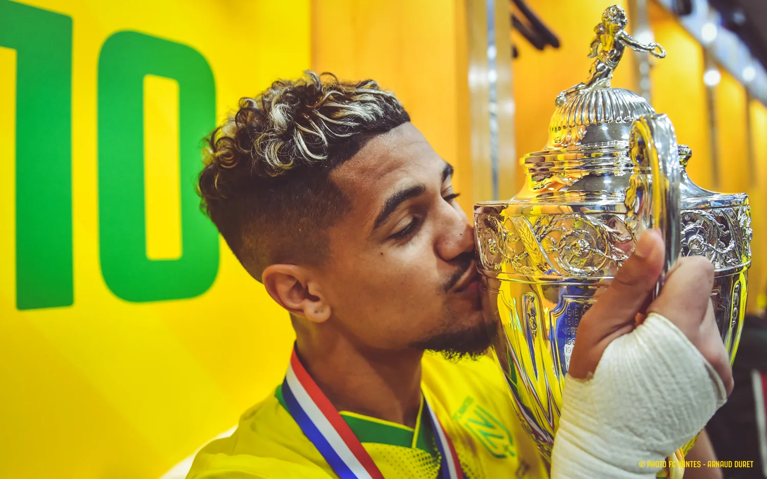 Nantes player Ludovic Blas kissing the Coupe de France trophy after the 2022 final
