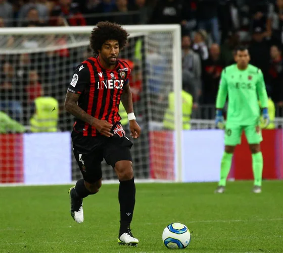 Nice defender Dante carrying the ball with his goalkeeper behind him during a match against Reims