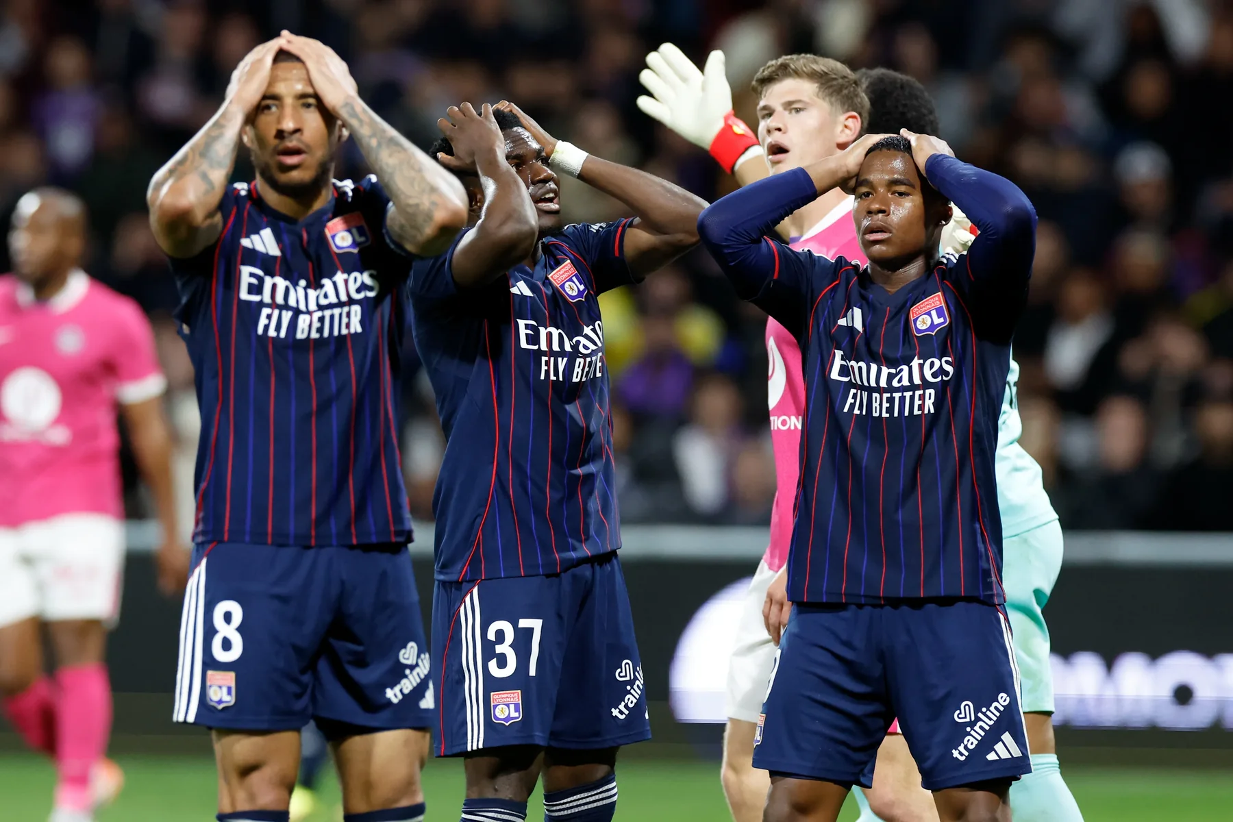 Paris Saint-Germain players react during a Ligue 1 match